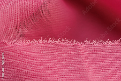 Photos Soft pink chiffon fabric with frayed edge close up delicate textile background a