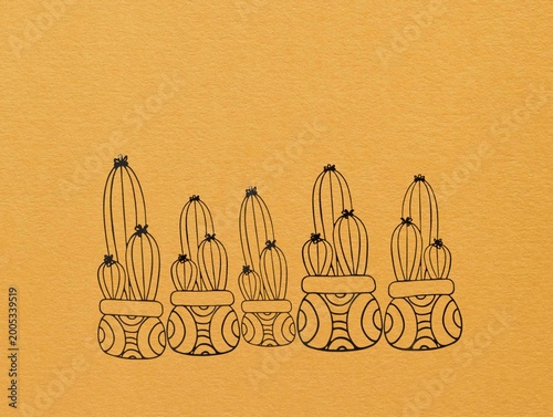 The yellow background in the image is made of black wire, intricately patterned to resemble a medicinal herb, used for decorative wall art. This beautiful artwork can be displayed on walls in homes or