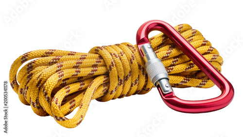Fotografi Yellow climbing rope with red carabiner and metal adjuster