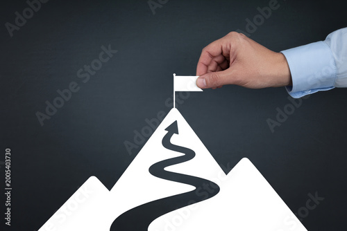 Hand holding upward trending arrow symbol above white background, upward arrow