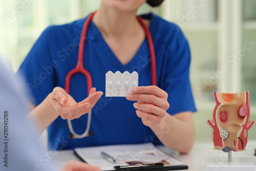Vászonkép Caucasian female clinician holding dental model and explaining teeth alignment a
