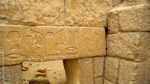 фотографія Ancient hieroglyphs and Anubis figure on Giza tomb architrave