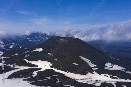 Tableau sur toile Aerial view of Okmok Volcano caldera with crater lake and glacial snow, Umnak Is