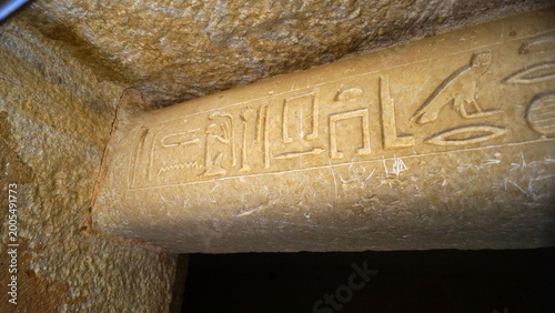 фотографія Сlose-up view of the beginning of a limestone architrave featuring ancient Egyptian hieroglyphs