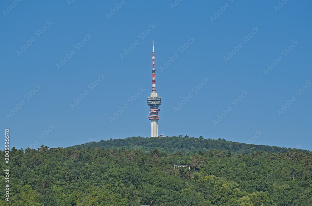 Obraz premium Television tower on the Misina peak of Mecsek mountains, surrounded by forest. Pecs, Hungary 