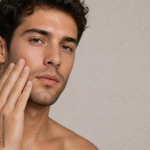 Young man touching face, male skincare routine and natural beauty concept