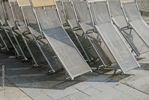 stack of deck chairs lined up