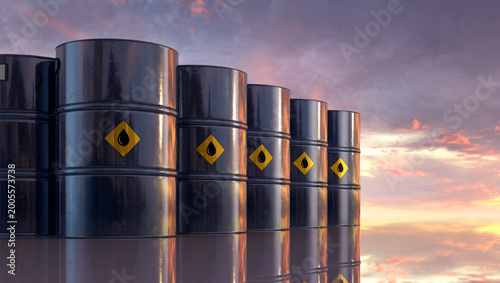 Schilderij op canvas Row of oil barrels in industrial setting