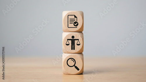 Legal Regulations and Symbolism: A captivating visual of three stacked wooden blocks, each adorned with a distinct symbol – a document with a checkmark, scales.