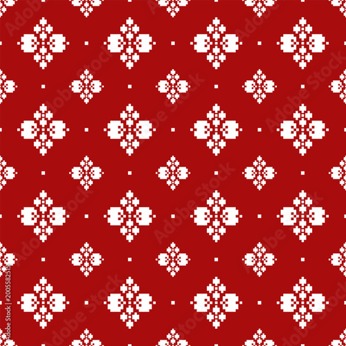 Photos Red seamless background with white floral geometric motifs arranged in a grid