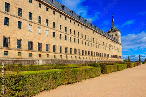 Beautiful El Escorial, or Royal Site of San Lorenzo de El Escorial, or Monasterio de El Escorial with garden. Famous kings residence near Madrid in Spain