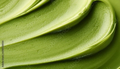 macro texture of swirled matcha green tea cream or cosmetic paste