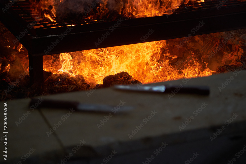 Obraz premium Burning fire pit used for roasting lamb during Samaritan Passover ritual