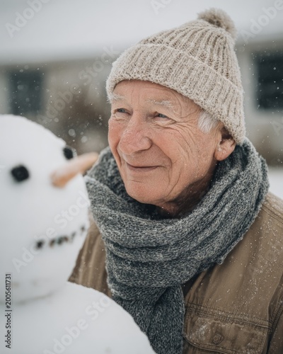 Smiling Elderly Man Looking at Snowman on a Peaceful Winter Day