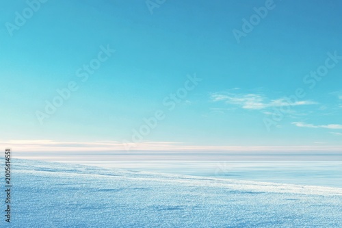 Minimal Winter Landscape with Snow Covered Horizon and Clear Blue Sky