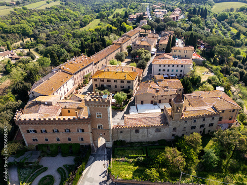 Close-up aerial view of the iconic red brick tower and entrance to the historic village.