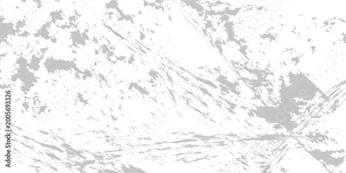 A large mountain range with rugged terrain and sparse vegetation under a cloudy sky