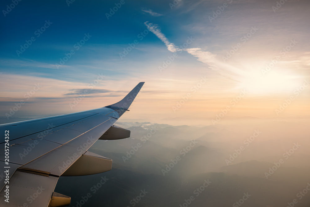 Fototapeta premium Aerial view from the plane over foggy clouds