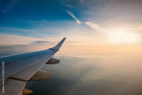 Aerial view from the plane over foggy clouds