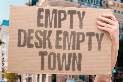 фотографія "Empty Desk Empty Town" Vacant school desks foreshadow documented broader community depopulation