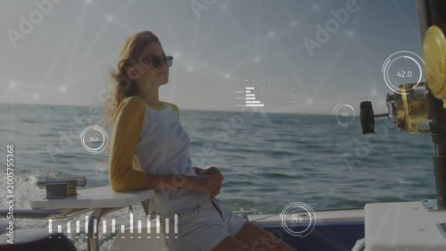 Teen rider reclining boat wake lifting hair turning tech HUD overlaying view near reel seeing sea