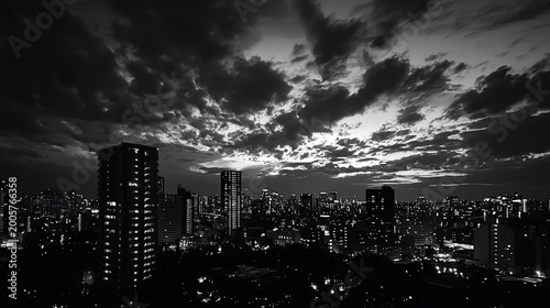 Monochrome Metropolis A Dramatic Nocturnal Cityscape Beneath a Turbulent Textured Sky.