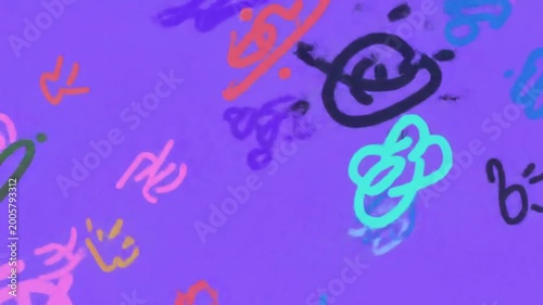 Abstract colorful hand drawn scribbles on a vibrant purple background