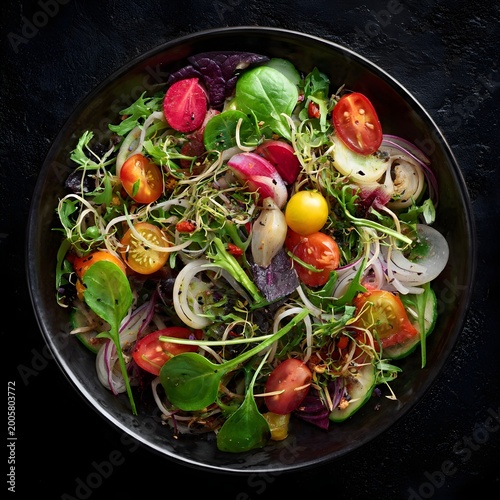 Fresh Gourmet Salad Bowl with Mixed Greens, Tomatoes, Radish, Egg and Red Onion – Top View