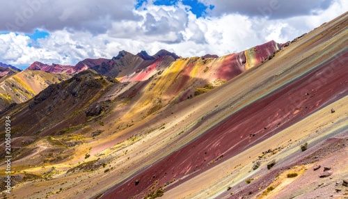 Striking Rainbow Mountain Landscape in Peru Under Cloudy Skies.
