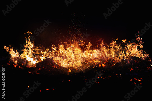 Halloween Witch . Fire embers particles over black background. Fire sparks background. Abstract dark glitter fire particles lights.