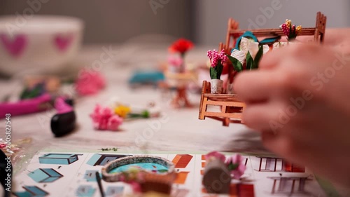 Close-up of female hands opening a bag of beads and details to create handmade jewelry. Craftswoman creating unique custom accessories in creative workshop. Handcrafted DIY jewelry artwork concept.