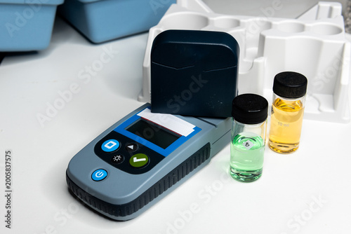 Portable water testing kit with sample vials and container