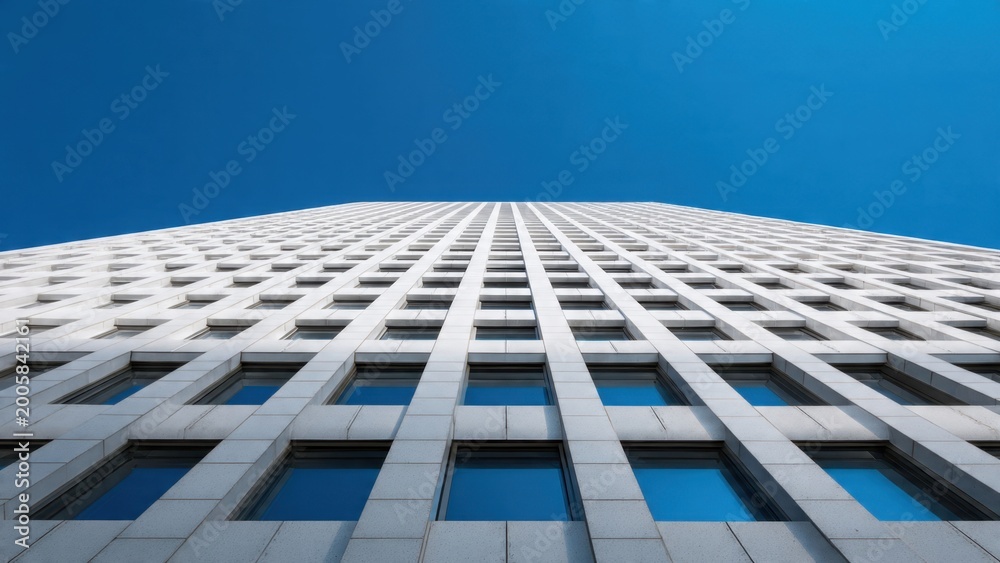 Fototapeta premium Modern Skyscraper Against Clear Blue Sky