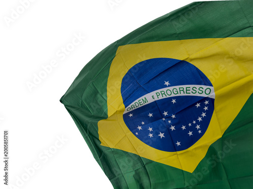 Brazilian flag cut out and isolated is waving in the wind, national symbol of Brazil with green, yellow and blue colors, representing patriotism, culture, identity and government.