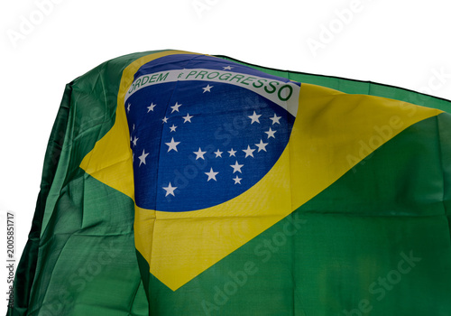 Brazilian flag cut out and isolated is waving in the wind, national symbol of Brazil with green, yellow and blue colors, representing patriotism, culture, identity and government.