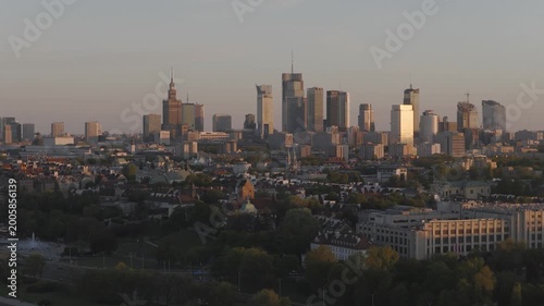 Breathtaking drone shots from Warsaw's Praga side of the Vistula capture sunset glow over the skyline. Golden light bathes bridges, rivers, and cityscape in warm hues