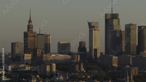 Breathtaking drone shots from Warsaw's Praga side of the Vistula capture sunset glow over the skyline. Golden light bathes bridges, rivers, and cityscape in warm hues