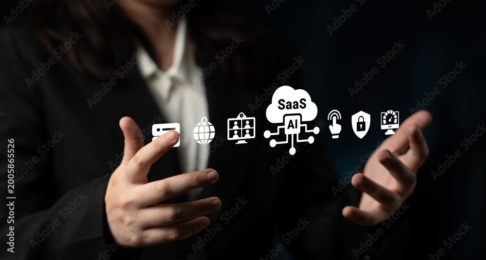 Obraz premium A business professional showcases technology applications using hand gestures, emphasizing the impact of SaaS and AI on modern industry and digital transformation. Ledger