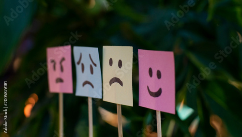 Cuadro en lienzo Different emotional faces on colorful sticky notes with blurred background