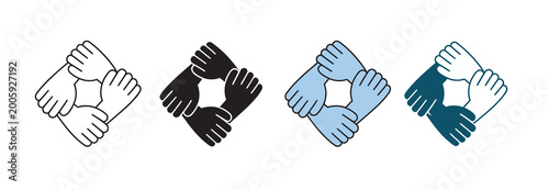 Fotografie Four hands clasped together in a circle, representing unity and teamwork