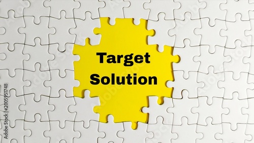 A white jigsaw puzzle features a central gap exposing a yellow background with the words 
