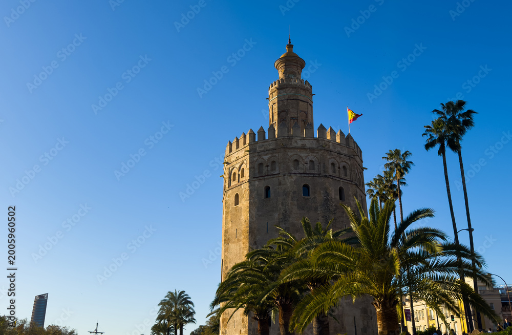 Naklejka premium Tower of Gold Torre del Oro military watchtower built in 13th century by Almohad Caliphate on the bank of Guadalquivir river in Seville, Andalusia, Spain.