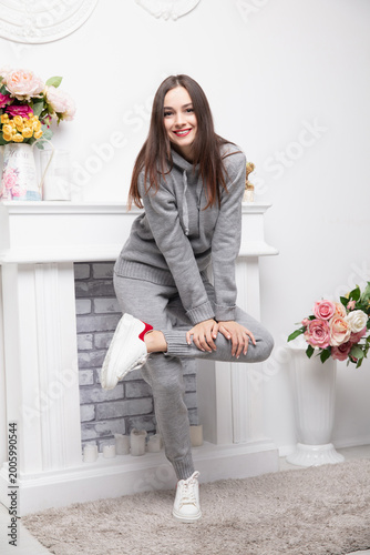 Sexy brunette dressed in a gray suit