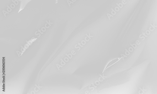 Soft clear plastic bag texture highlighting subtle wrinkles and smooth light reflections. Blank transparent stretch film mockup background for packaging concepts. PNG cutout element.