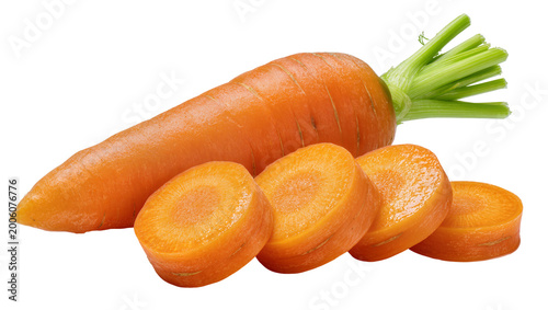 Whole orange carrot with green tops and slices, isolated on transparent background