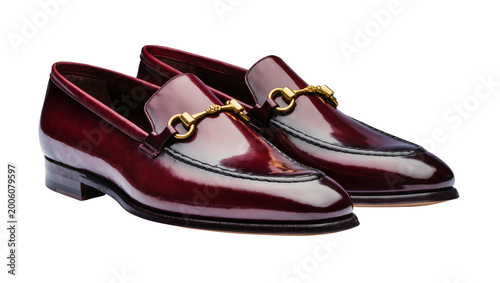 Foto Shiny burgundy leather loafers with gold horsebit detail, isolated on transparen