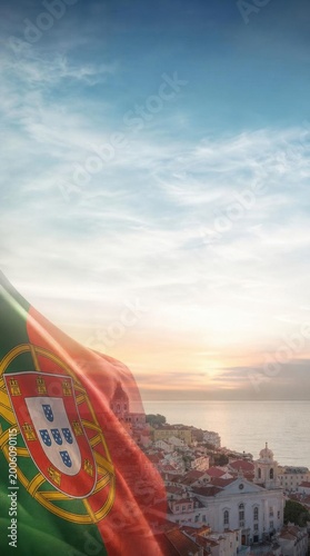 Portuguese flag in Lisbon cityscape at sunset, symbol of national heritage