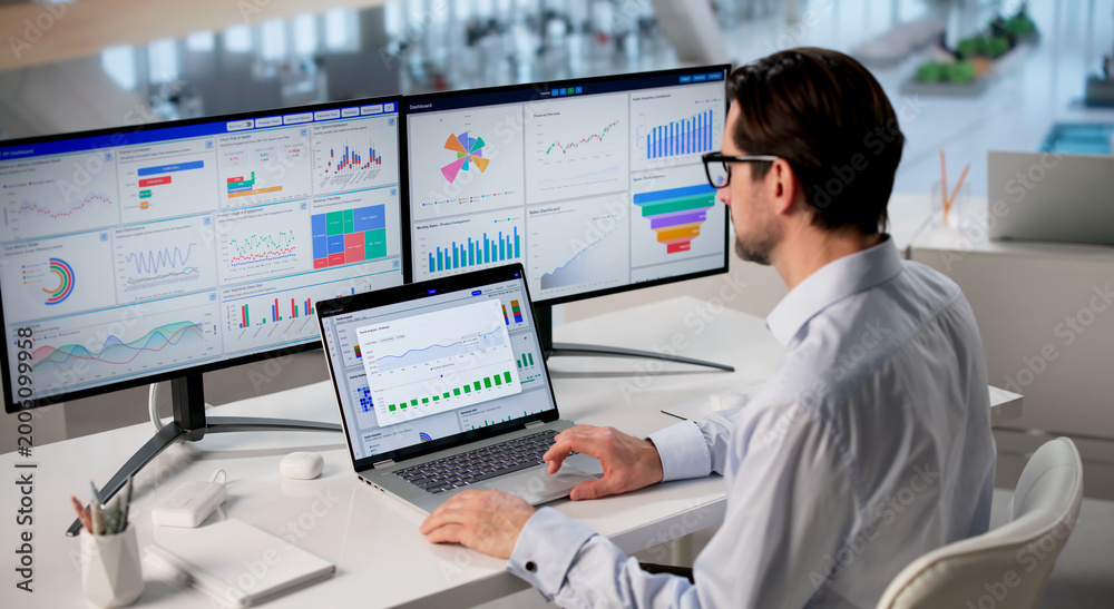 Fototapeta premium Mature Financial Analyst Studies Market Charts And Reports