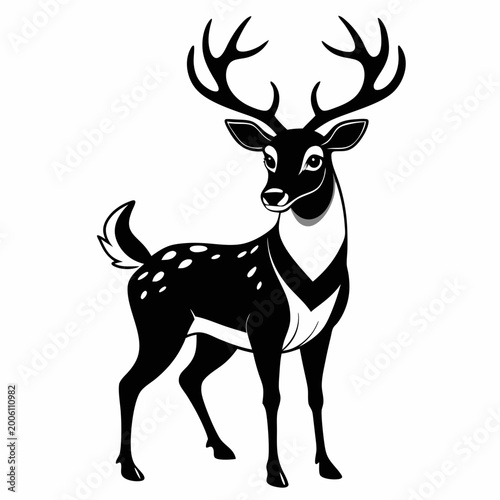 Black and white deer with large antlers standing