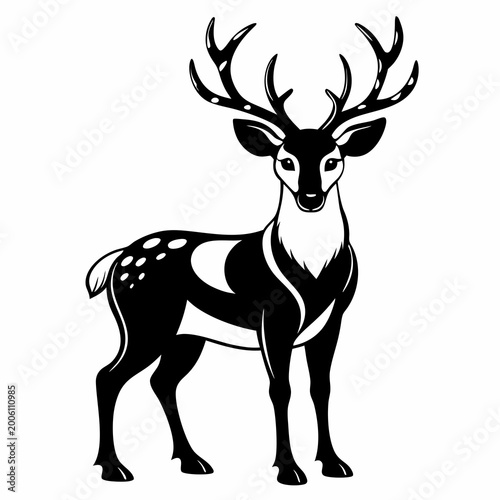 Black and white deer standing with large antlers